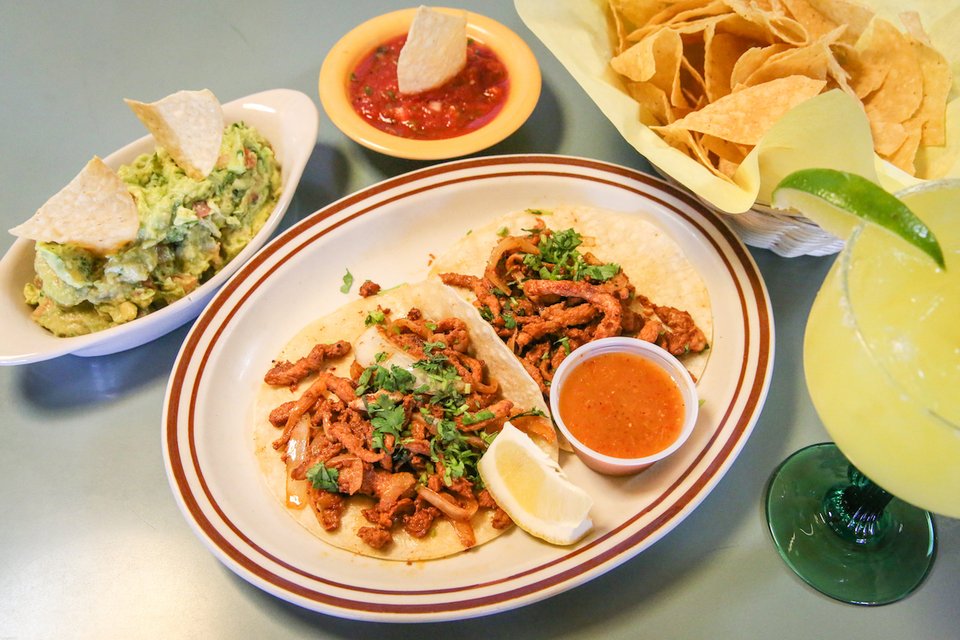 Colorful plates and drinks on a restaurant table