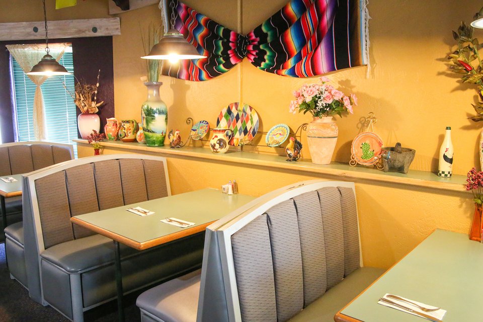 Casual dining space with booth seating and warm lighting